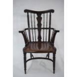 An antique Anglo-Indian spindle-back elbow chair