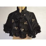 A Victorian jet beaded black silk satin evening cape