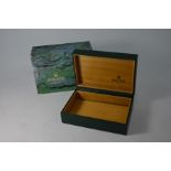 A Rolex Oyster wood lined green leather box