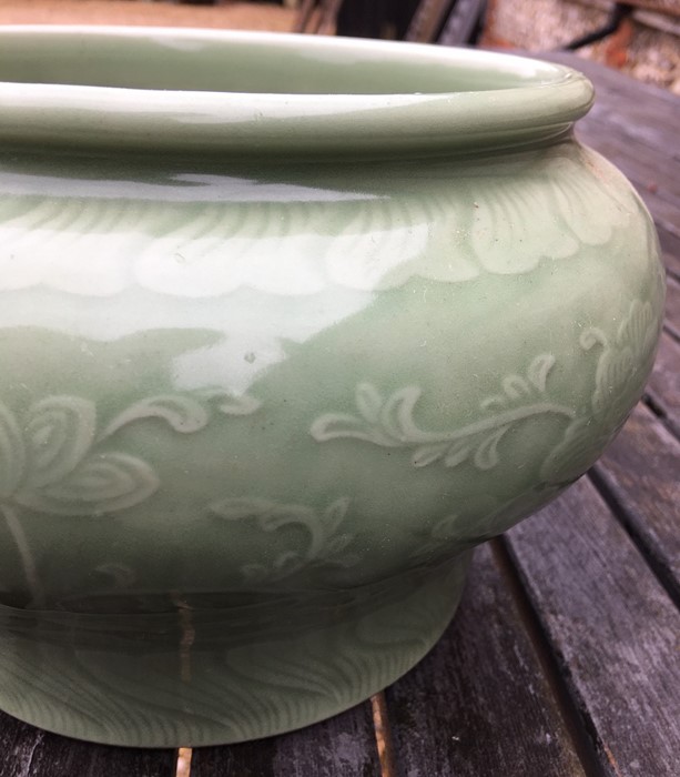 A Chinese celadon peony scroll jardiniere, Qing or later, 15 cm high - Image 6 of 9