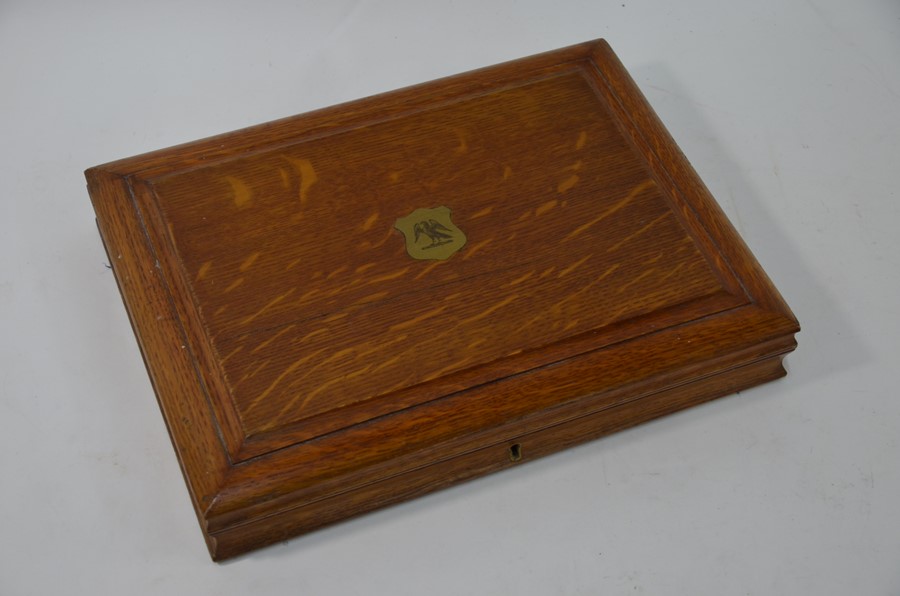 An Edwardian oak-cased silver fish knives and forks