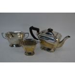 A heavy silver three piece tea service