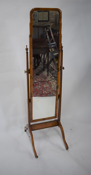 An antique walnut framed cheval mirror,