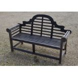 A weatherd Lutyens design teak garden bench