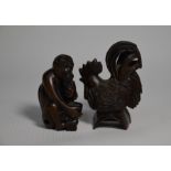Two 20th century Japanese carved wood netsuke