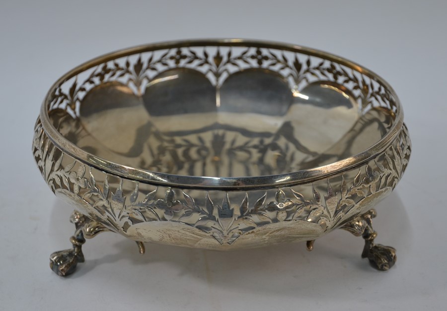 A heavy quality silver fruit bowl with foliate-pierced rim