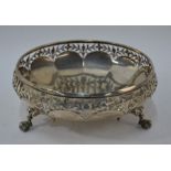 A heavy quality silver fruit bowl with foliate-pierced rim