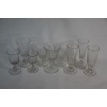 A collection of nine heavy half fluted 19th century drinking glasses