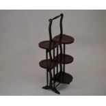 A five tier mahogany and satinwood inlaid double sided folding cake stand, 89 cm high