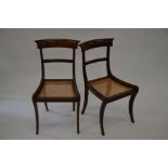 A pair of Regency rosewood sabre leg and cane seated side chairs (2) appear to have been restored,