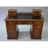 A Victorian oak pedestal desk