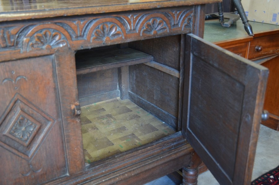 A 19th century lunette carved oak sideboard with panelled doors, turned supports and stretchers, - Image 4 of 4