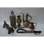 A wired glass soda syphon, cast iron 'dachshund' boot-scapeer, Tibetan prayer-wheel, Asia copper