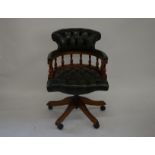 'Claridge Ltd', mahogany framed adjustable swivel/desk chair with studded and buttoned green leather