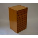 A ten drawer beech collector cabinet/plan chest, the push-open drawers with glazed lids, 88 cm tall,