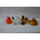 Two glass oil lamps with four shades and three chimneys (box)