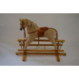 A fur fabric coated child's rocking horse