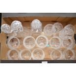 Various glassware including ten champagne coupes, three decanters and other glasses