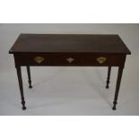 An Edwardian mahogany hall table with single frieze drawer raised on turned supports, 77 cm high x