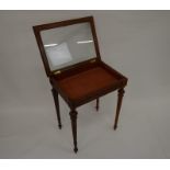 A French profusely carved walnut vitrine with glazed top raised on tapering fluted supports, 75 cm