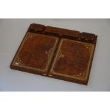 An Italian brown tooled leather folding correspondence set, opening to reveal blotter, letter