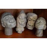 Four ethnographic stone heads