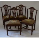 A set of four late 19th/20th century side chairs with pierced splats and tapestry covered drop-in