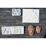 Pair of terracotta wall masks to/w cast classical wall panels