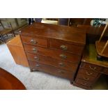 A George III mahogany chest of two short over three long drawers with floral brass handles and