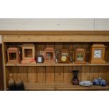 Three modern wooden cased mantel clocks with quartz movements to/w a brass carriage clock in