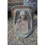 Weathered cast terracotta angel and tablet wall bracket