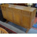 A good quality bespoke golden oak sideboard with four drawers over four panelled cupboard doors, 157