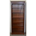 A mahogany open bookcase with five adjustable shelves, 198 cm high x 83 cm wide x 33 cm deep