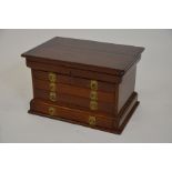 A 19th century mahogany table top collector's chest, with hinged lid and two short over three long