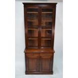 An Edwardian walnut chiffonier bookcase