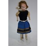 A 19th century wax-headed costume doll