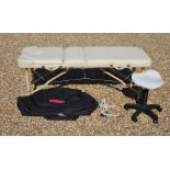 A Salonserve treatment table with carry case with adjustable legs, max height 85 cm, to/w adjustable