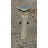 A weathered stone garden urn on square plinth to/w