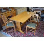 A good quality bespoke golden oak refectory style dining table with rectangular top raised on a pair