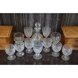 A glass decanter etched with flying birds, a set of six wine glasses and other glassware
