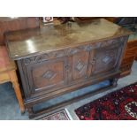 A 19th century lunette carved oak sideboard with panelled doors, turned supports and stretchers,
