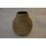 A stoneware vessel with ribbed decoration, 40 cm high