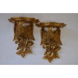 A pair of Georgian style decorative wall brackets in the form of eagles above foliage (2)