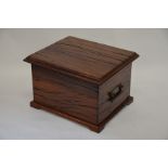 A small hardwood trunk, with hinged lid and carry handles to each side, 40 cm high, 63 cm wide, 53