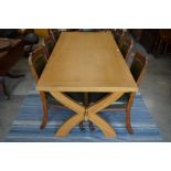 A modern light oak dining table on cross frame stretcher, 180 cm long, 89 cm wide