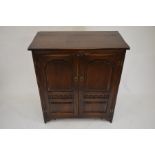 An oak two door TV cabinet