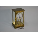 Elkington, Paris branded lacquered brass four window clock