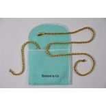Tiffany & Co - A yellow metal spiga style chain necklace and bracelet