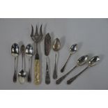 Silver bread fork and teaspoons