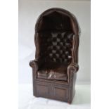 A traditional brass studded brown leather porters chair by Claridge Ltd